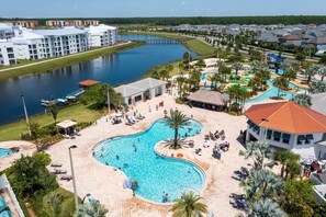 A resort with a large pool, a water park, and a marina. - Lake-view Near Disney Resort w Lazy River 108 3151 (Kissimmee)
