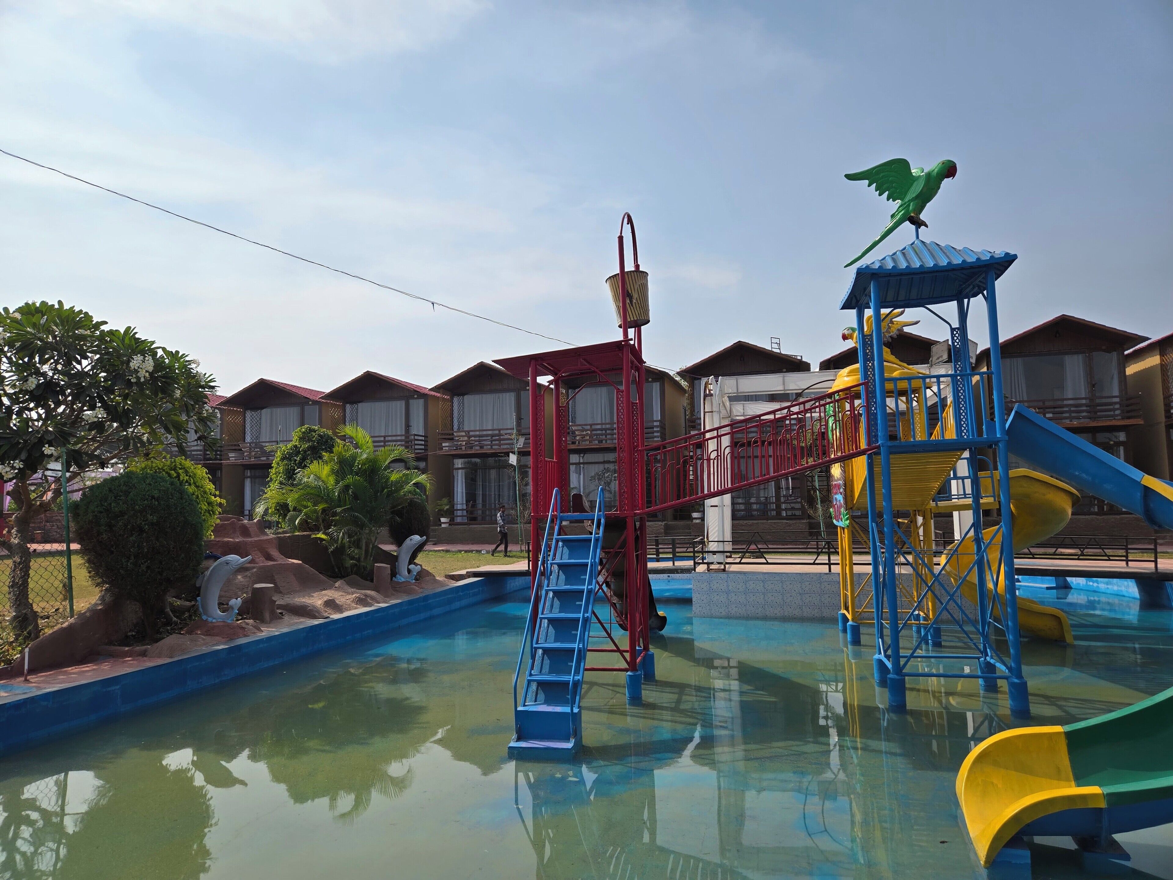 A water park with slides and a climbing structure.