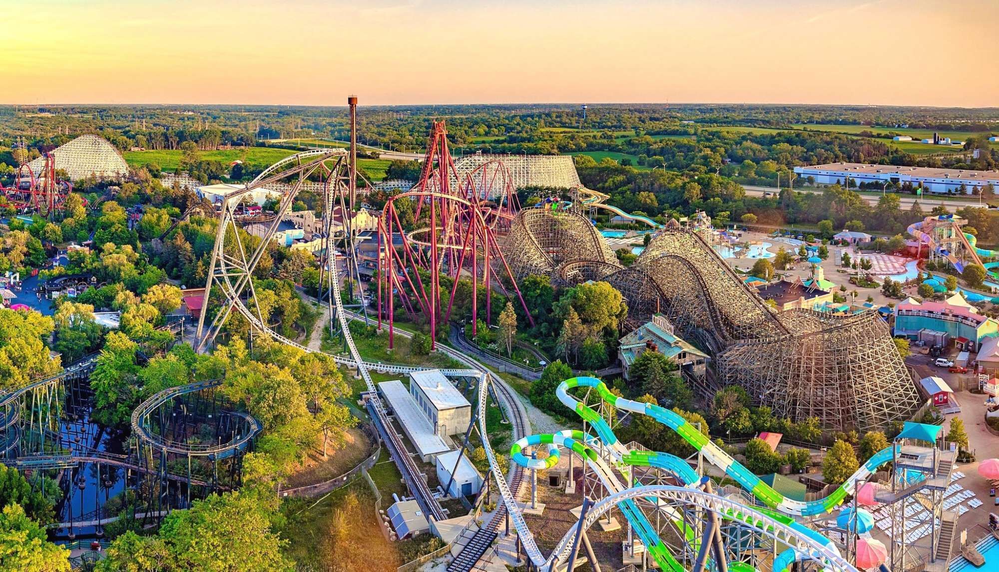An aerial view of a theme park with various roller coasters and attractions.