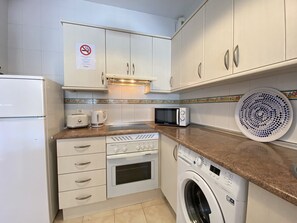 Apartment | Private kitchen | Highchair - Apartment in Nerja Near Burriana Beach (Nerja)