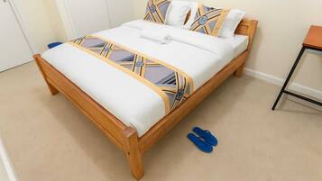 Desk, laptop workspace, blackout curtains, iron/ironing board