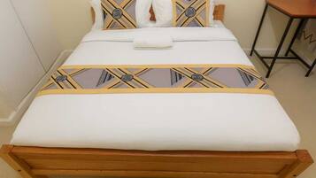 Desk, laptop workspace, blackout drapes, iron/ironing board