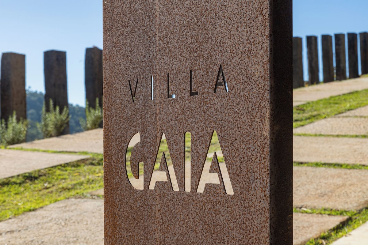 A sign with 'VILLA GAIA' engraved on a textured surface.