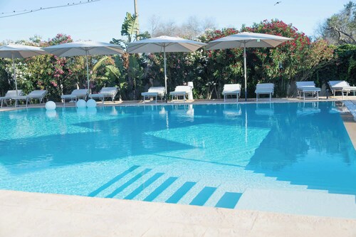 Boomerang Home 1 – Suite nel Boomerang Village Resort 4 Stelle – a soli 5 minuti da Punta Prosciutto