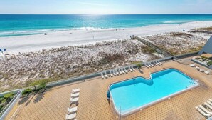 A beachside pool with a view of the ocean and beach. - Top Floor Beachfront - Great Views From Top Floor! Beach Service! (Fort Walton Beach)