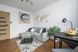 Classic Apartment, Balcony, City View | Living room | 30-inch Smart TV with digital channels, Netflix, streaming services - Lumina 2-room apart near the Old Town (Warsaw)