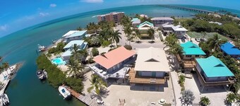 Waterfront Remodeled Home w/ Private 35’ Boat Dock  - at the foot of the iconic 7-Mile Bridge. Cozy house, water views, outdoor entertaining, private XL hot tub,  walk to Sunset Grill for pool. Perfect for fishing, boaters, divers & sunset lovers.