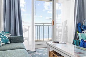 Bright, breezy living space that opens to the balcony. - Sunrise Resort 7th Fl Beach/Pool/Hot tub/FamilyFun (North Myrtle Beach)