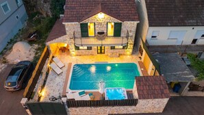 A two-story stone house with a swimming pool, outdoor seating, and a hot tub. - Cozy Villa for 8 with Pool and Jacuzzi (Šumet)