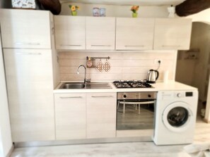 Fridge, oven, cookware/dishes/utensils