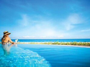 Outdoor pool, a heated pool - Ritz-Carlton Oceanfront Suite with Hotel Amenities by Guaranteed Rental™ (Riviera Beach)