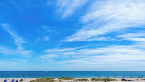 A beach with clear skies and calm waters.