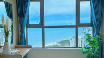 Apartment, 3 Bedrooms, Ocean View | Desk, blackout drapes, iron/ironing board, free WiFi