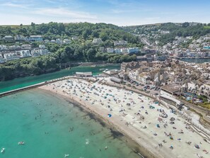 A coastal town with a beach, buildings, and a bridge. - 4 Bed in Looe (oc-l30051) (Looe)