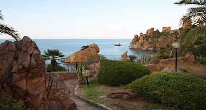 Villa Faraglioni is an exclusive residence immersed in a truly unique natural setting, suspended between sky and sea. Perched on a cliff overlooking the coves of Cefalù, the villa guarantees total privacy and direct access to its own private beach.We ar