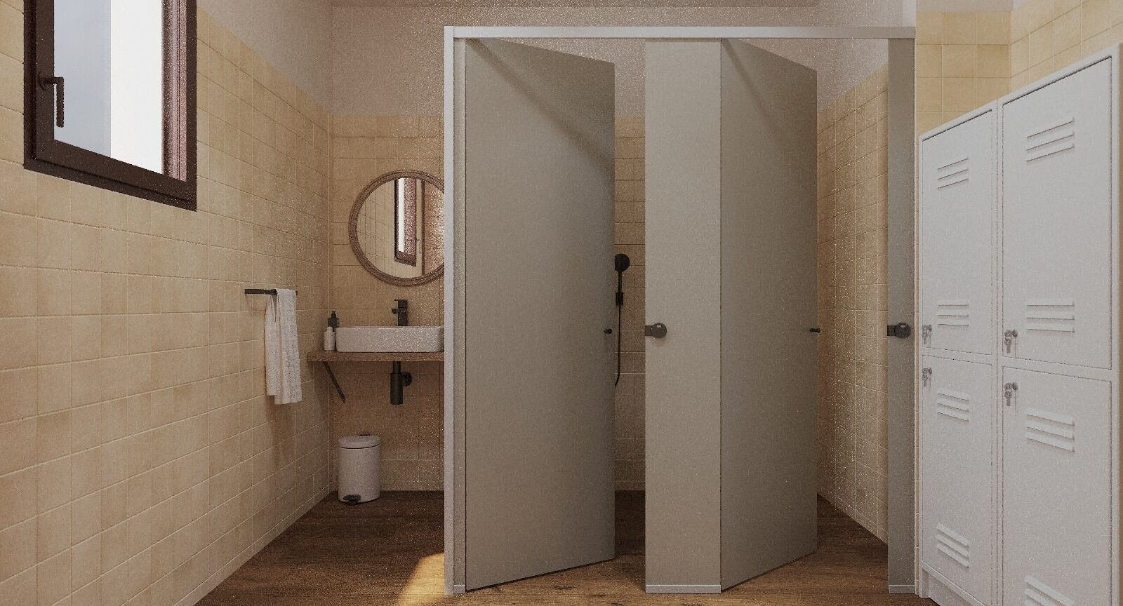 Een badkamer met beige betegelde wanden, een wastafel, een spiegel en een deur die naar een kleedkamer leidt.