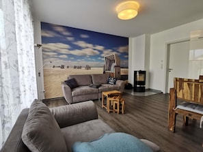 Living area - "Lotte Dree" vacation apartment: high-quality vacation apartment in the middle of the national park (Zingst-Müggenburg)