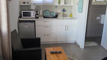 Mini-fridge, microwave, cookware/dishes/utensils