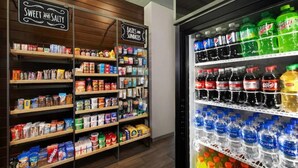 A beverage vending machine stocked with various sodas and water bottles. - Resort with 2 bedrooms and AC in lovely Marco Island (Marco Island)