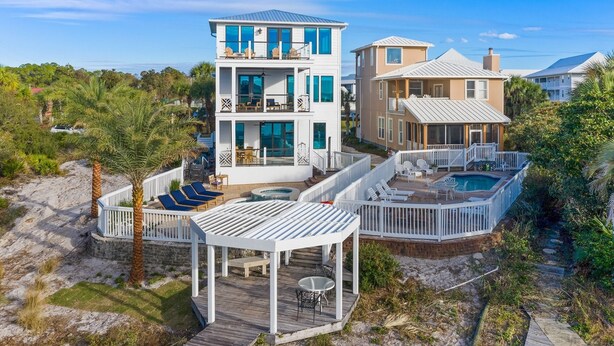 A multi-story beachfront property with a pool, deck, and multiple levels of outdoor seating. - Lakefront with Pool and Gulf Views (Santa Rosa Beach)