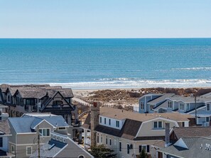 A coastal residential area with houses, a beach, and ocean views. - 4BR/3BA Beach Home w/ Rooftop Deck & Outdoor Living (Ocean City)
