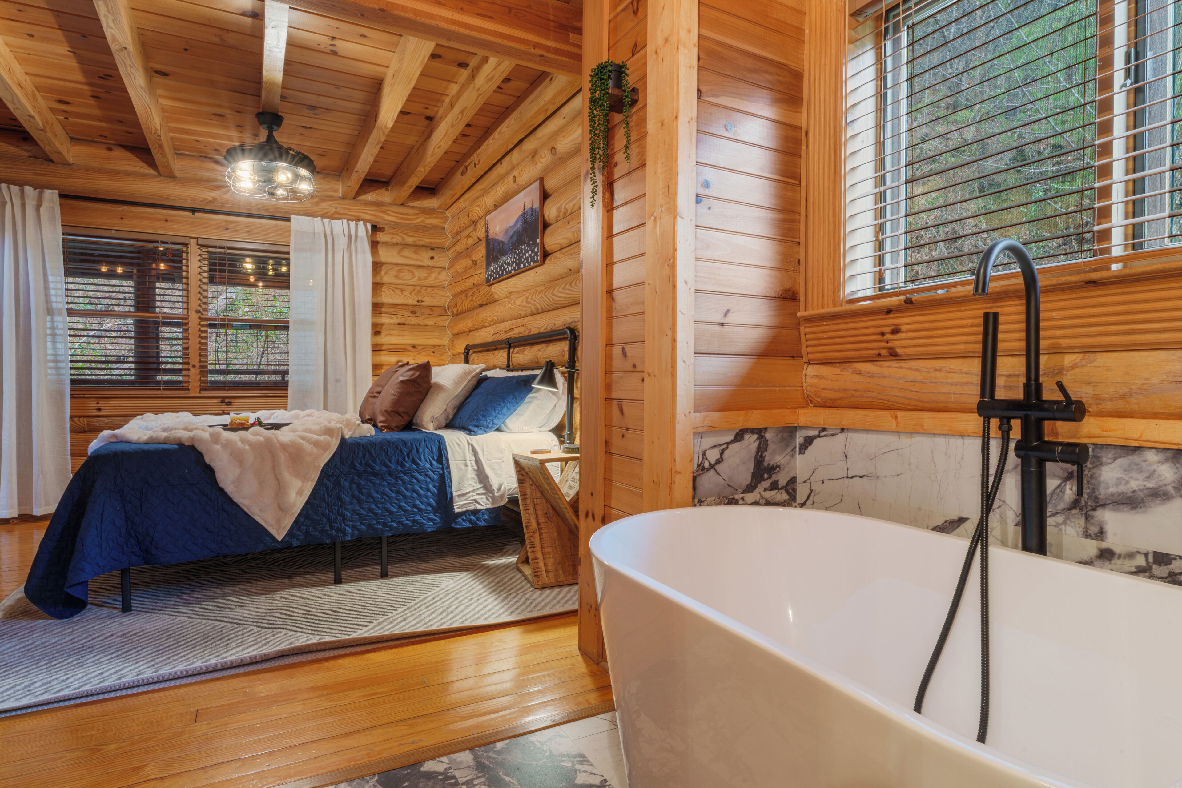 King bed & soaking tub in the primary bedroom