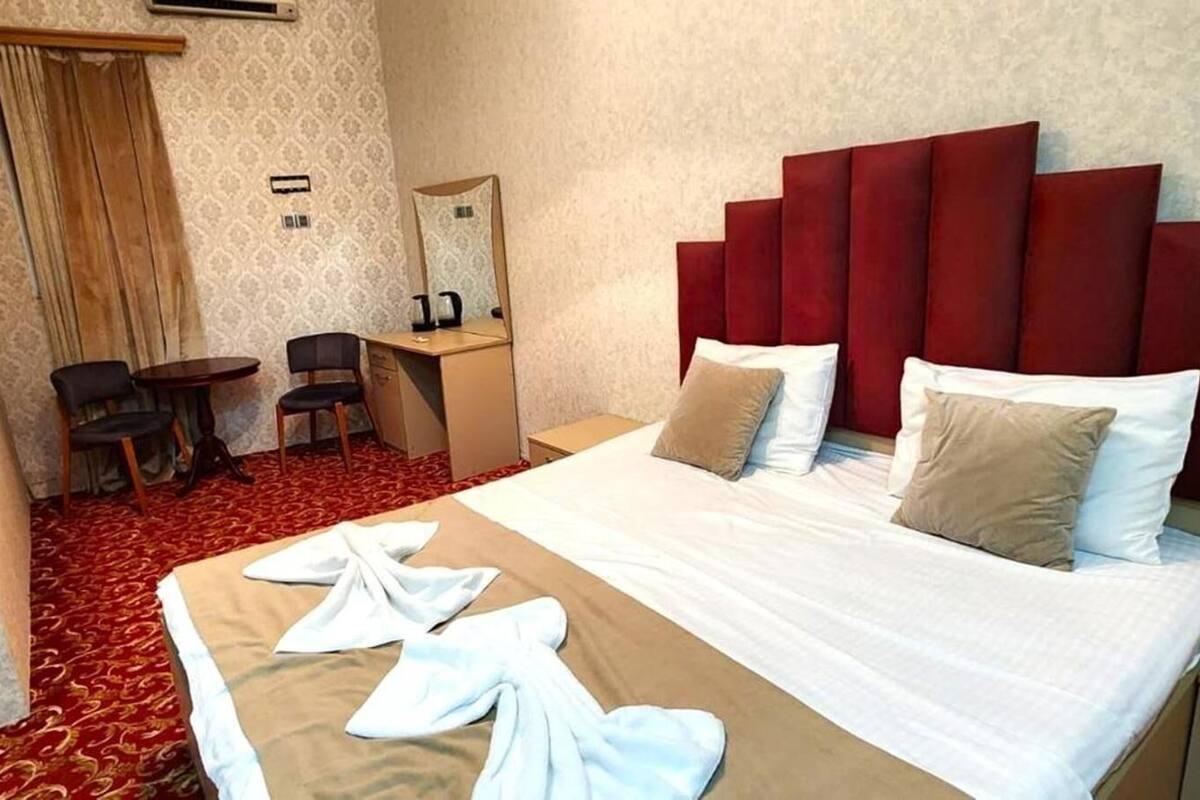 Premium bedding, desk, laptop workspace, free WiFi