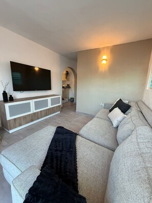 Living area - Enjoy a cozy and modern, renovated Cozy Boho Apt Near Ojo de Agua in Vega Baja. (Vega Baja)