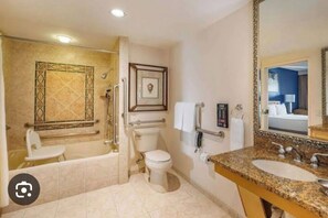 A bathroom with a bathtub, toilet, and sink. - Magnificent Resot in kissimmee, close to parks and entertainment, FL. (Celebration)