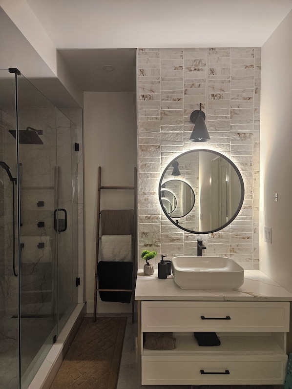 Shower, hair dryer, towels, soap