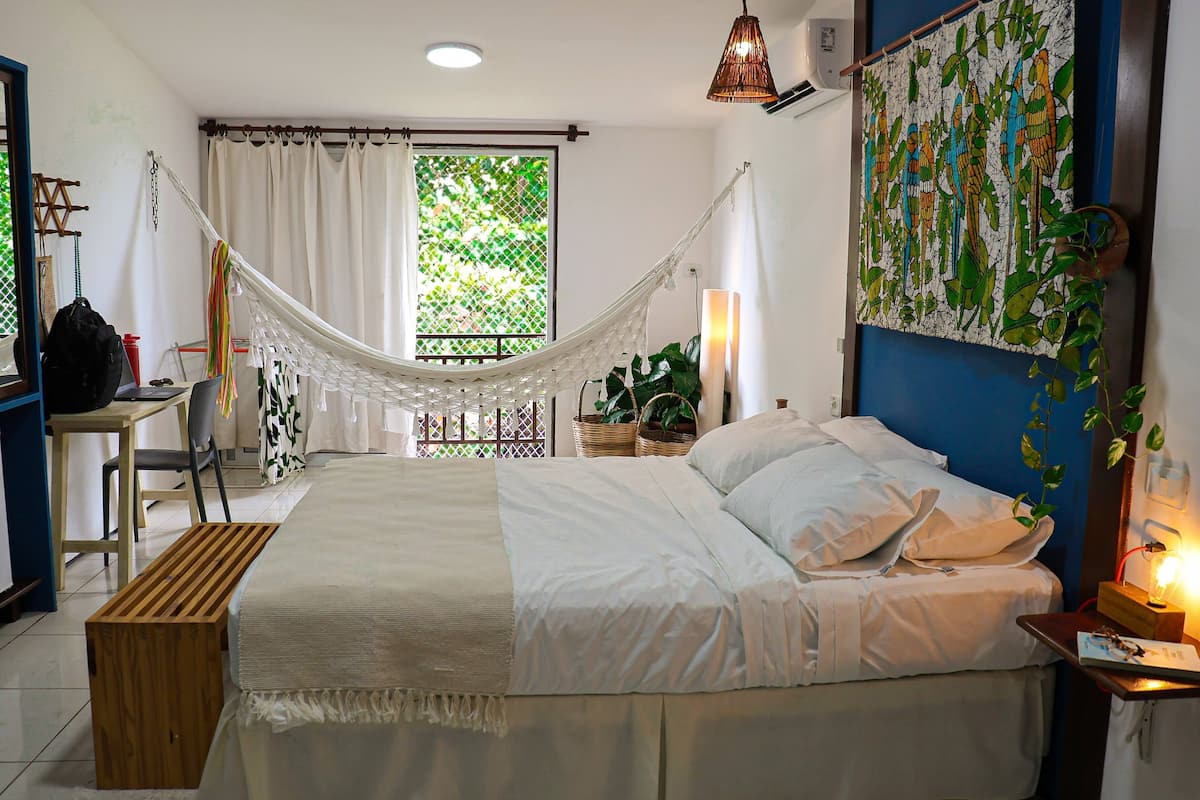 Quadruple Room, Garden View | In-room safe, desk, laptop workspace, blackout drapes