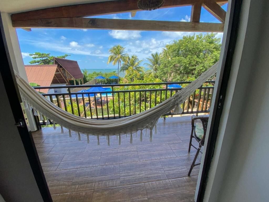 Deluxe Suite, Balcony, Pool View | Property grounds