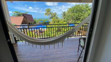 Deluxe Suite, Balcony, Pool View | Property grounds
