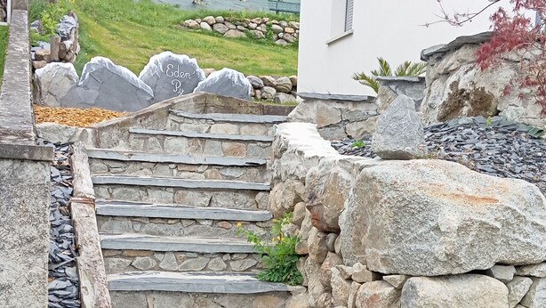 A stone staircase leading up to a stone wall with a sign that reads "Eden Py." - Mountain house 8 persons 4 épis with Sauna (Arcizans-Avant)