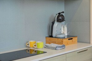 Fridge, coffee/tea maker, cookware/dishes/utensils