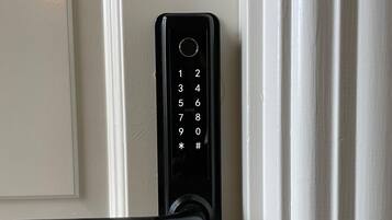A numeric keypad door lock with a handle, labeled with the number 2.
