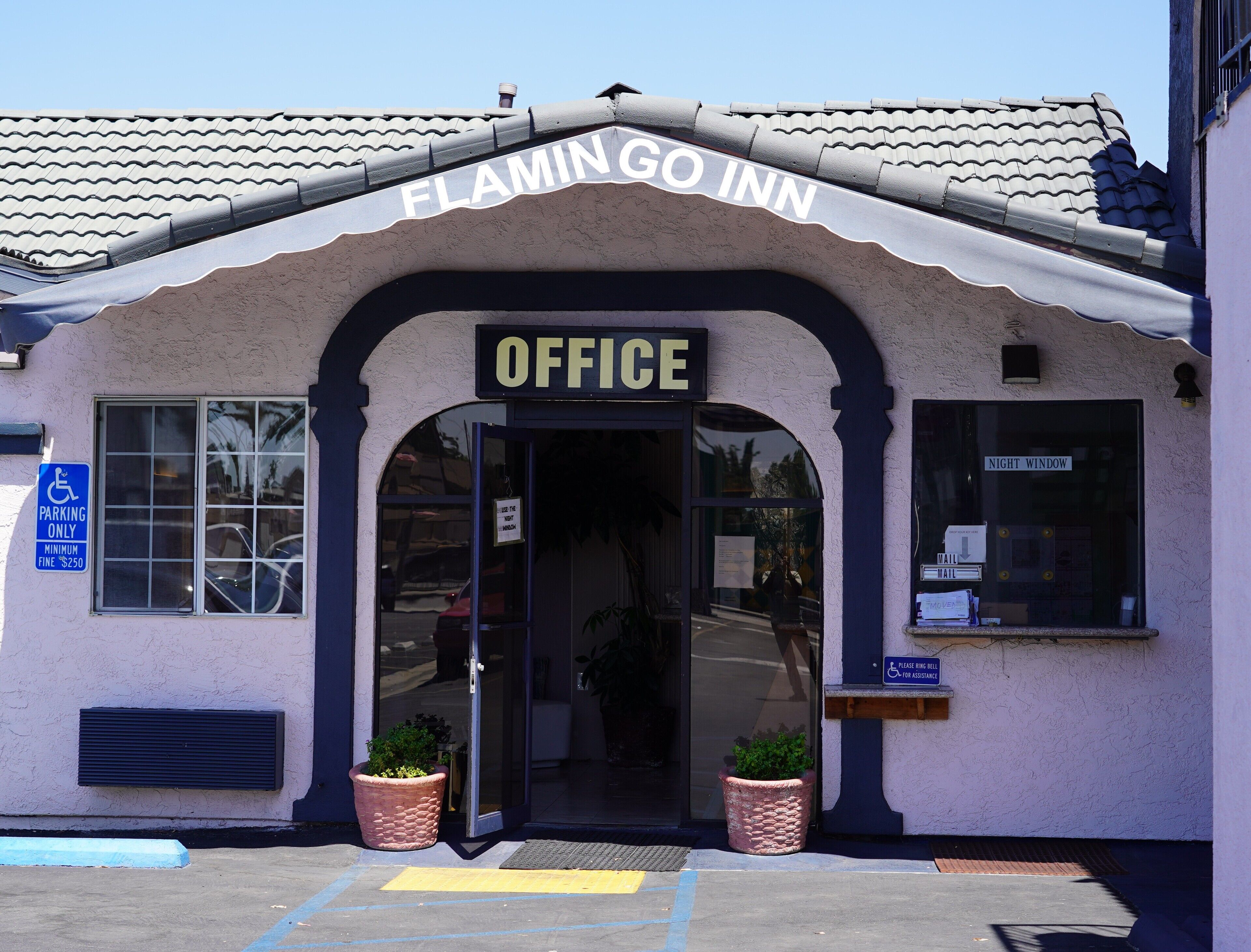 The exterior of Flamingo Inn with an 'Office' sign above the entrance.