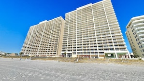 A high-rise hotel with multiple balconies and a beachside location. - Beachfront Studio w/ Bunks Sleeps 4 at Majestic! (Panama City Beach)