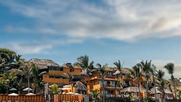 On the beach, white sand, sun loungers, beach umbrellas