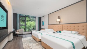 A hotel room with two beds, a sofa, a TV, and a large window offering a view of greenery. - Xana Hotel Guilin Wuyue Square  Branch (Guilin)