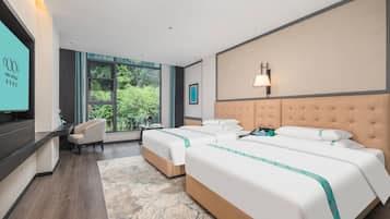 Down duvets, memory-foam beds, desk, laptop workspace