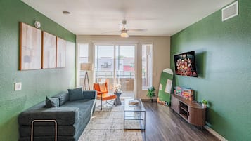 Deluxe Apartment, 2 Bedrooms, Non Smoking, Kitchen | Living area | 55-inch Smart TV with digital channels