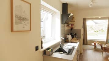 Fridge, microwave, stovetop, coffee/tea maker