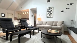 A living room with a sofa, two armchairs, a coffee table, and a ceiling fan. - NEW LISTING! Rehoboth by the Sea - Ocean Block - 19 Cullen St (Dewey Beach)