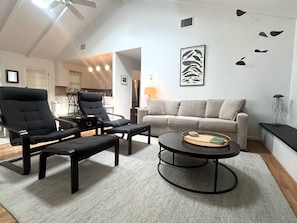 A living room with a sofa, two armchairs, a coffee table, and a ceiling fan. - NEW LISTING! Rehoboth by the Sea - Ocean Block - 19 Cullen St (Dewey Beach)