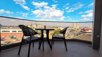 Deluxe Condo, City View | Desk, laptop workspace, iron/ironing board, free WiFi