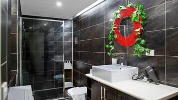 Shower, hair dryer, towels, soap