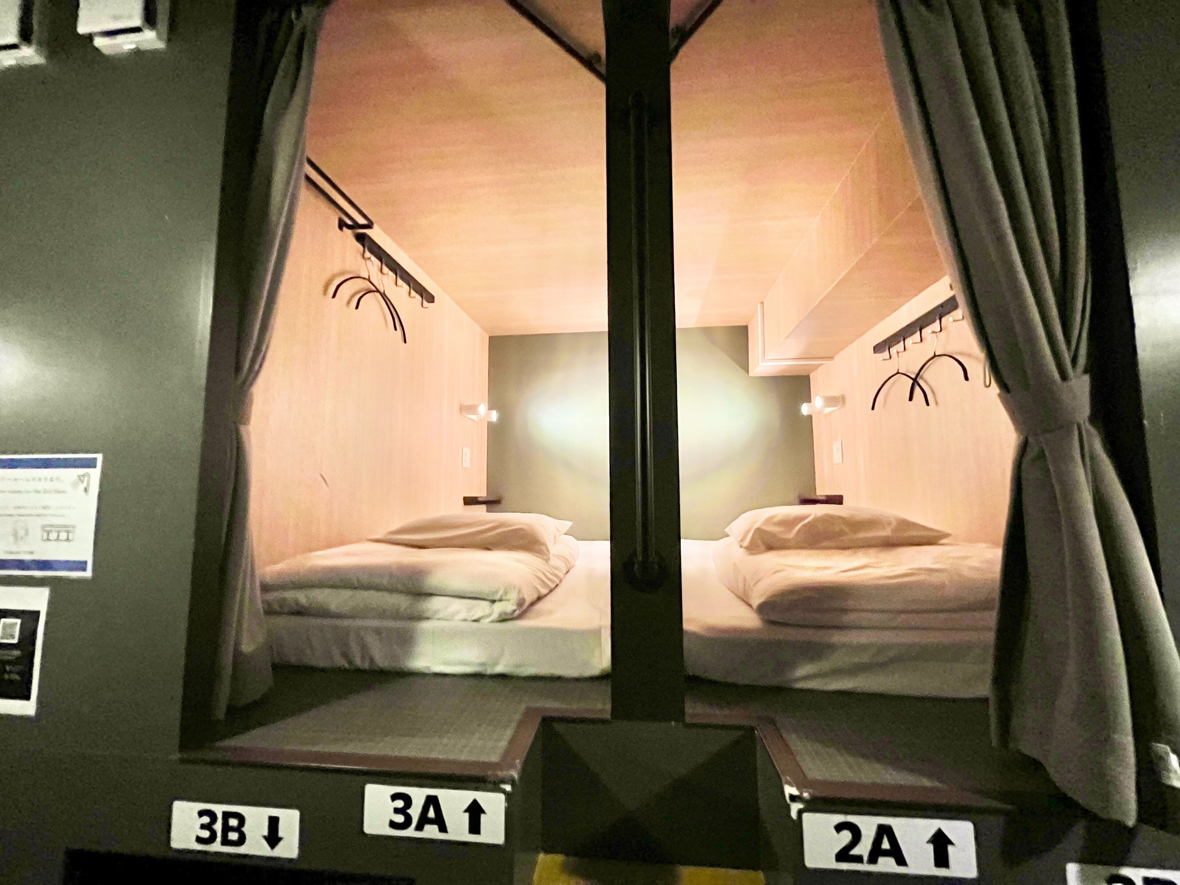 A mirrored room with bunk beds, labeled with 3B, 3A, and 2A.
