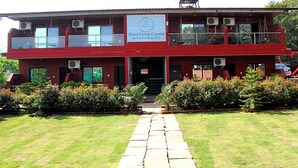 A two-story building with a sign reading "Hotel Green Crystal." - Hotel Green Crystal (Mahabaleshwar)