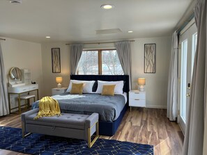 A bedroom with a bed, bedside tables, a desk, a chair, and a window with curtains. - Spacious getaway in peaceful Ephraim - just few minutes away from Sister Bay (Sister Bay)